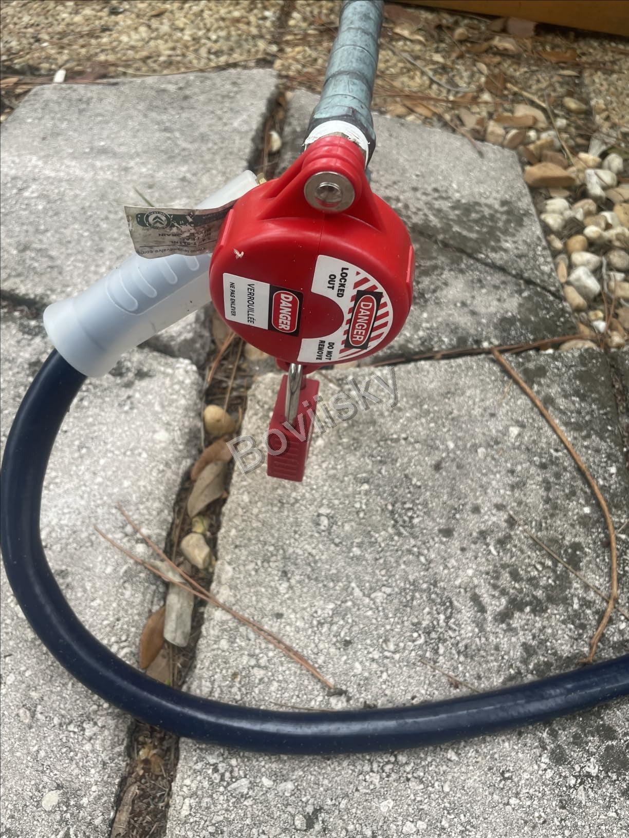 Cable lockout applied outdoors with a safety padlock