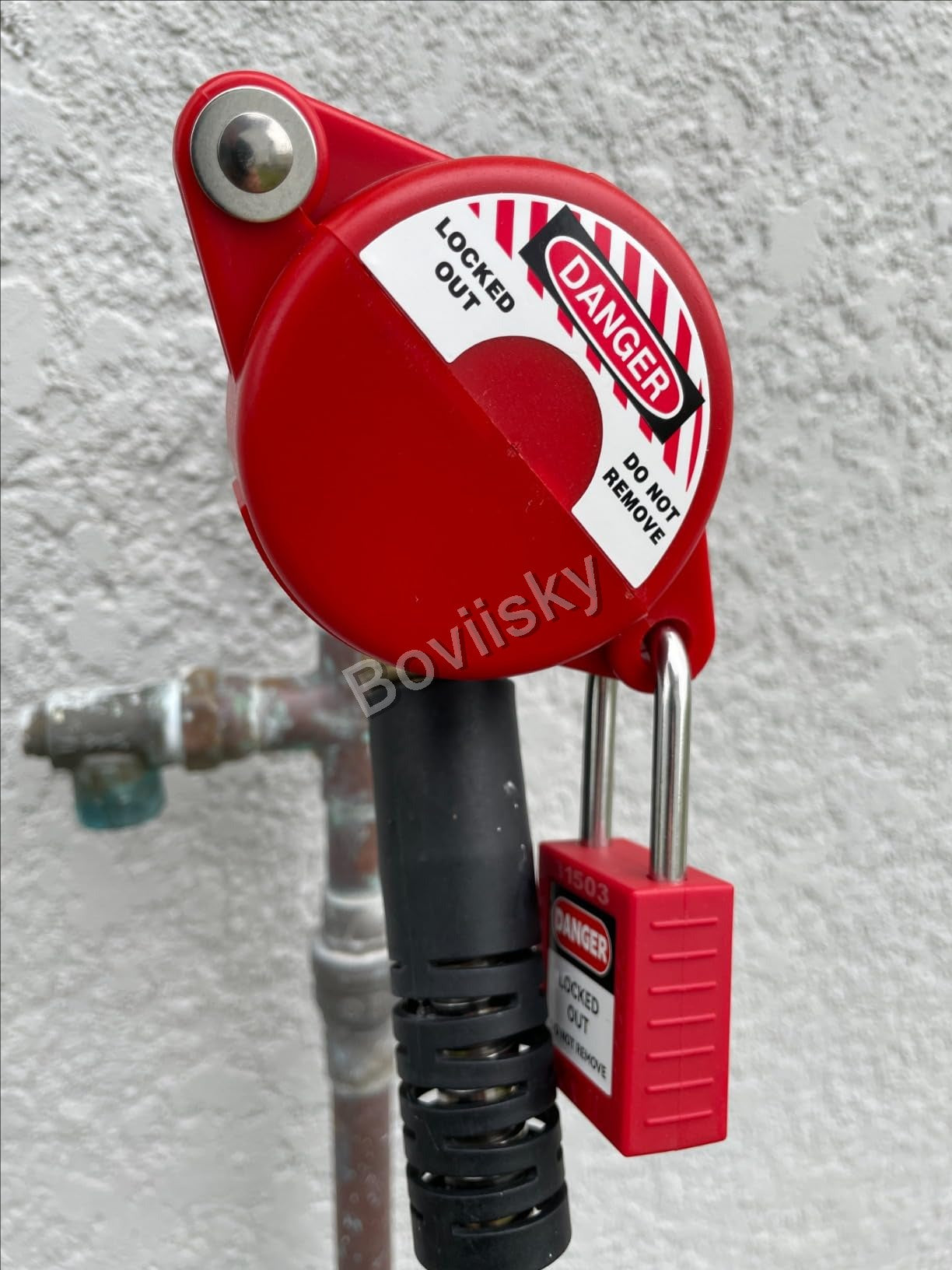 Cable lockout device secured with a safety padlock