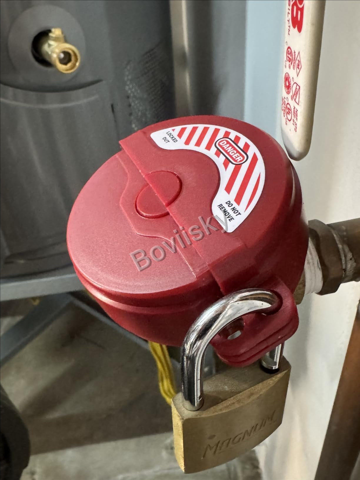 Valve lockout device secured with a padlock