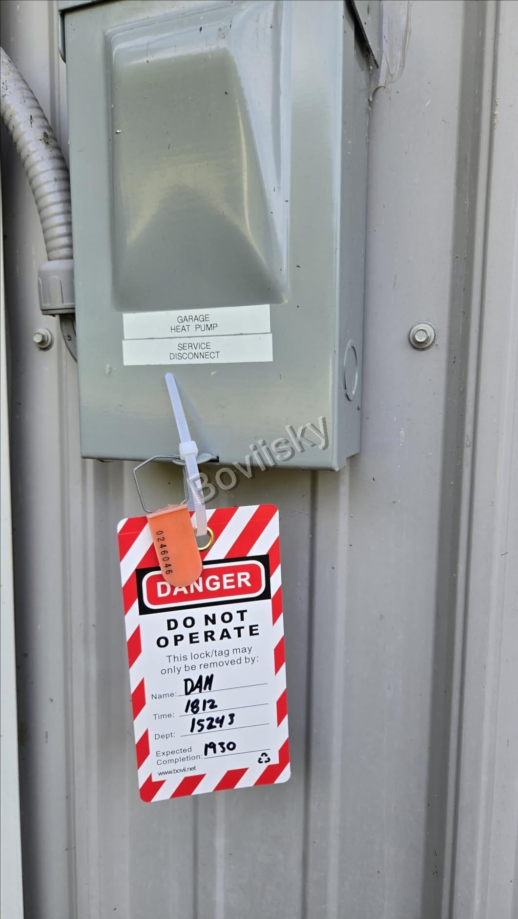 Heat pump disconnect marked with a do not operate tag